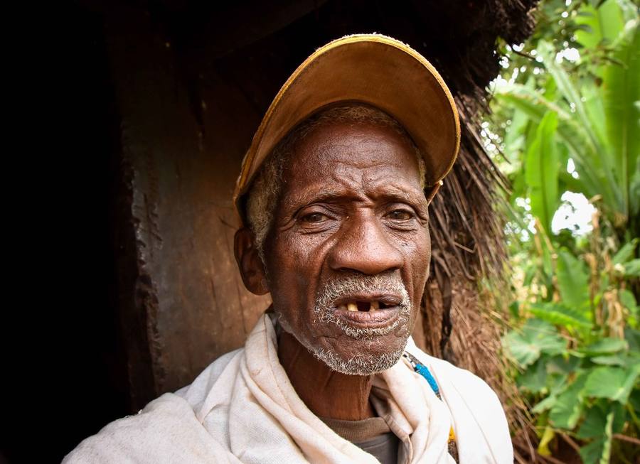 A Meadowbrook grower smiling in a green field